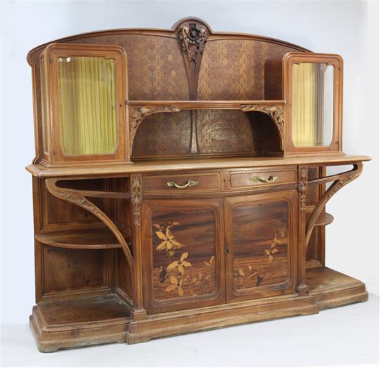 A Louis Majorelle Chicoree pattern walnut and marquetry buffet, W.7ft 4in. D.1ft 10in. H.6ft 6in.